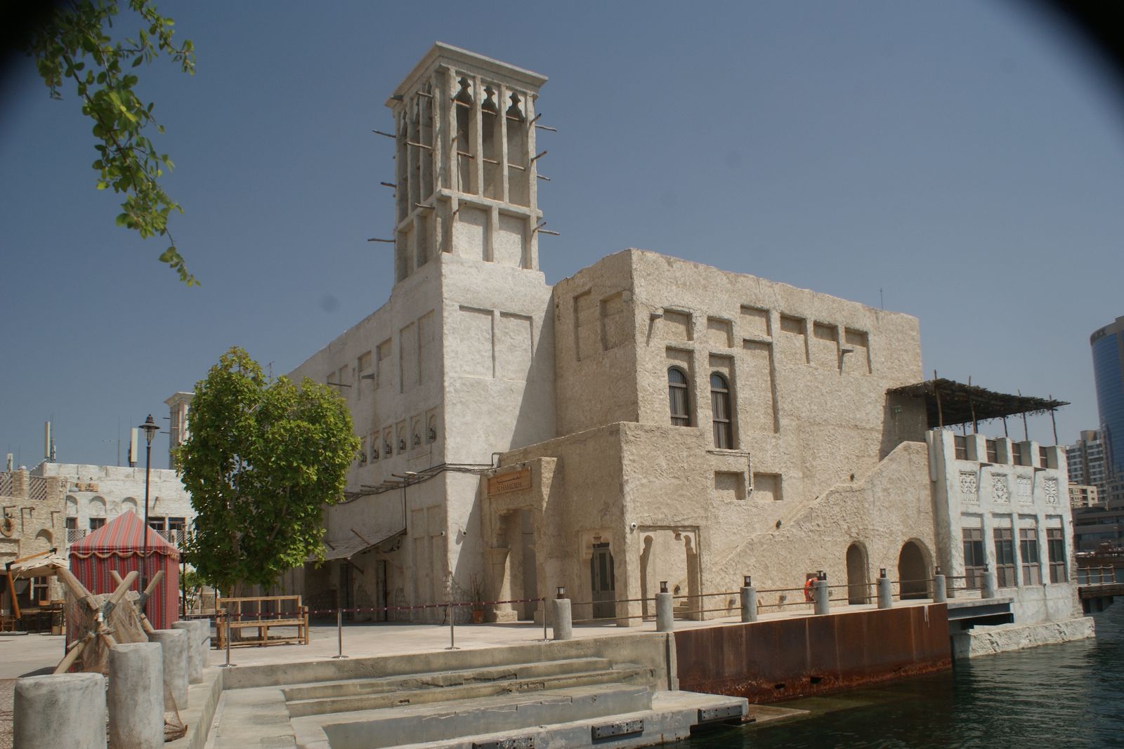 Heritage-style wind-tower buildings along the waterfront at Al Seef on Dubai Creek